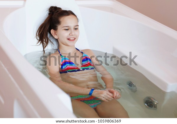 Teen girl in tub