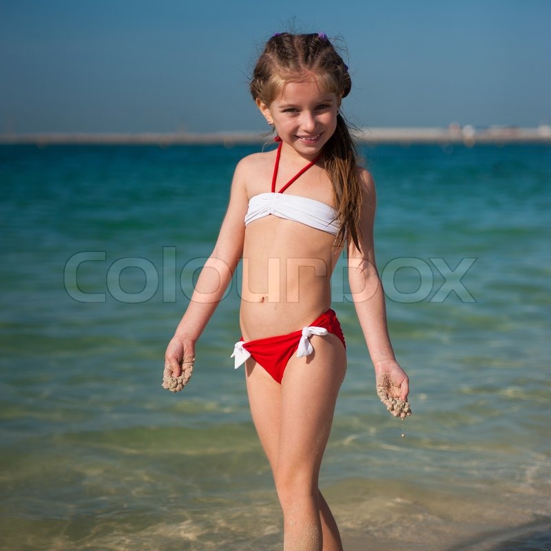 Young cute girls at beach
