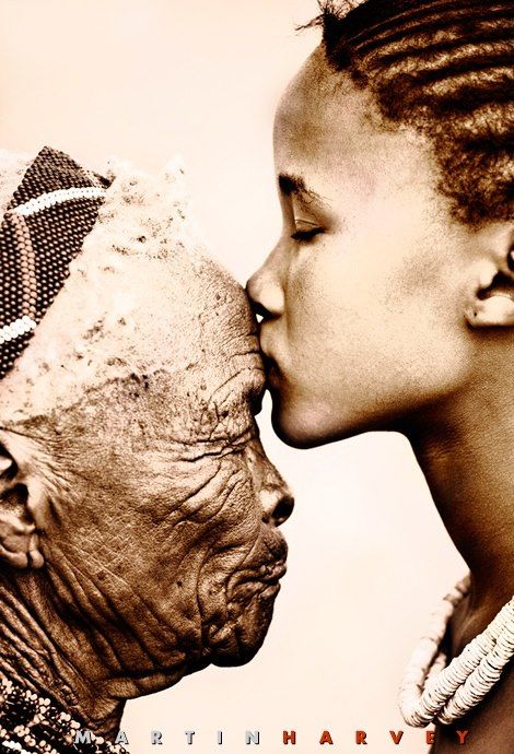Old woman young girl kissing